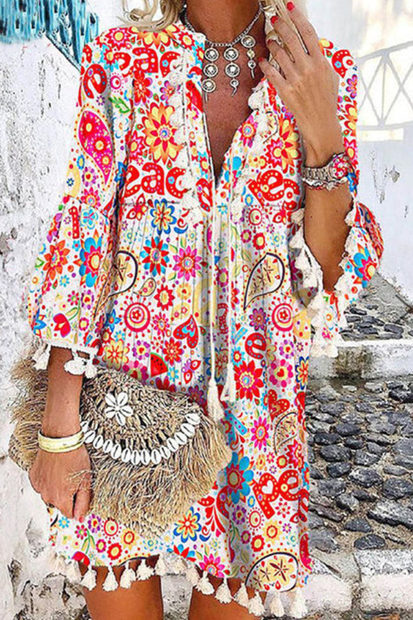 Vestido mini floral boémio para mulher com bainha com borlas e decote com laço